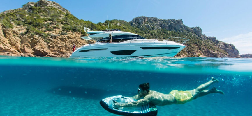 Young person using a sea scooter underwater