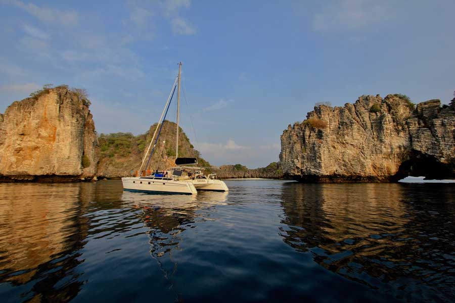 Clear blue water and limestone cliffs at Koh Haa